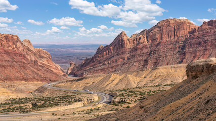 Driving in the desert down the winding Interstate Highway 70 through Spotted Wolf Canyon in Utah,...