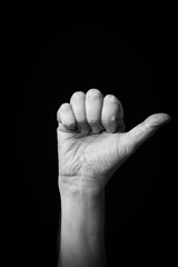 Hand demonstrating the Arabic sign language letter 'ض' or 'Dhad'