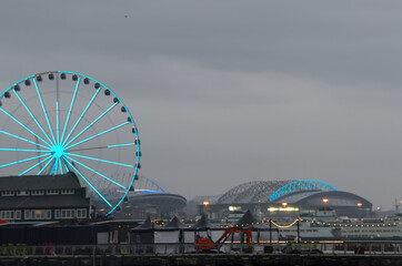The Seattle ferris wheel during a chilly rainy day in the fall.