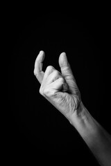 Hand demonstrating the Arabic sign language letter 'ن' or 'Noon'