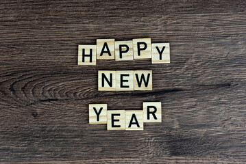 Fototapeta premium Happy New Year - wooden word (wooden letters, wooden sign)