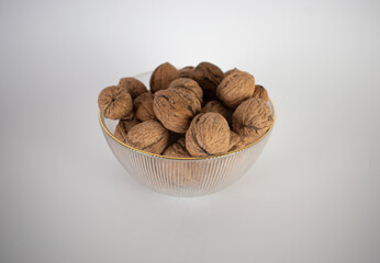 Bowl of walnuts white background 