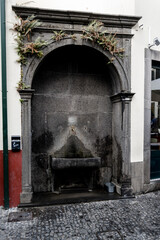 Fototapeta na wymiar monuimental basalt fountain at Camara do Lobos, Madeira