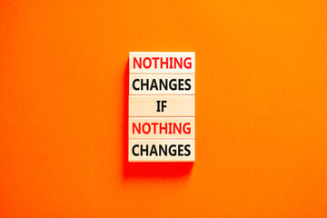 Nothing change symbol. Concept words Nothing changes if nothing changes on wooden blocks. Beautiful orange table orange background. Business nothing changes concept. Copy space.