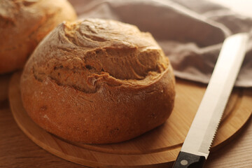 A loaf of rye bread in low key