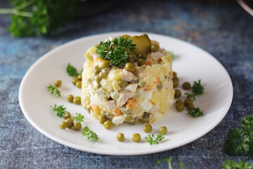 Olivier salad, traditional Russian dish, served on the plate