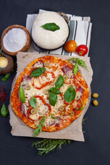 Delicious fresh pizza on dark - 546348423