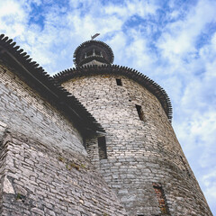 Old stone wall and watchtower of the Pskov Kremlin, Russia