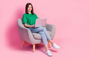 Full size photo of cheerful gorgeous girl sit floor use wireless netbook isolated on pink color...
