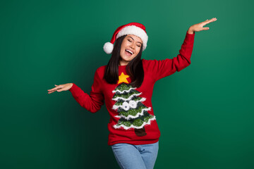 Photo of pretty cute relaxed japanese woman raise hands up active motion dancing xmas music wear...