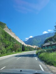 Beautiful road to the mountains against blue sky. Slovenia. Travel. Road trip
