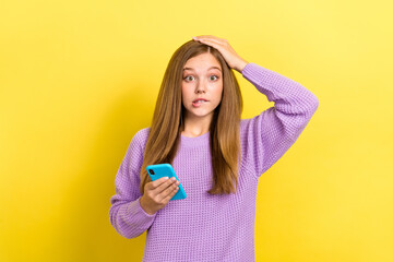 Photo of young scared puzzled girl touch head nervous unexpected reaction oops hold smartphone scam...