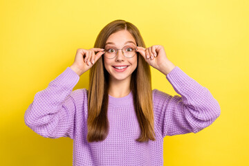 Closeup photo of young shopaholic teenager girl cute person showing her new stylish expensive eyeglasses nice vision isolated on yellow color background