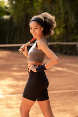 Cute african american girl with tennis racket