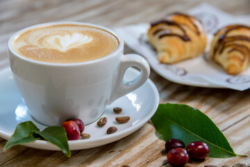 Typical peruvian food and drinks, cappuccino with croissant