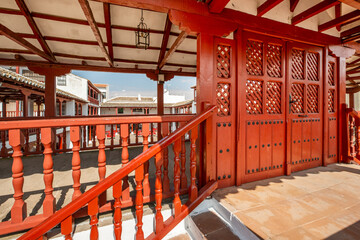 Red wooden structure in the town square