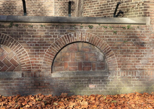 Amsterdam Sint-Agnes Kerk Church Exterior Brick Wall Detail With Autumn Leaves, Netherlands