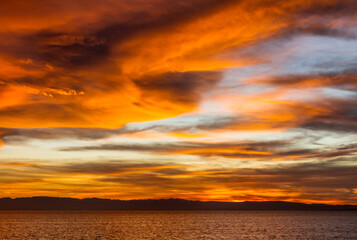 winter sunset over the ocean on California bay