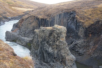 Autumn in the Studlagil Canyon - Basalt Rock Columns and Glacial River Jokuldalur, East Iceland