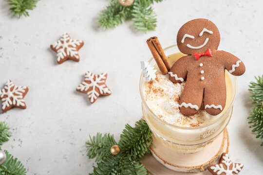 Happy Gingerbread cookie man in a Christmas cocktail. Happy holidays card