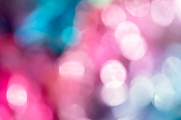 Fototapeta premium Blurred bokeh background for Christmas and New Year holiday. Abstract colorful wallpaper with defocused lights. Copy space