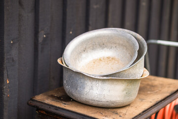 Three dented old bowls