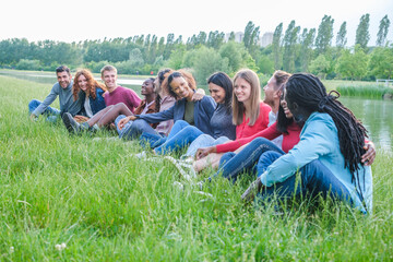 Heterogeneous group of young people from different origins enjoying an afternoon outdoors