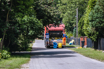 Garbage truck in a village in Wegrow county, Poland