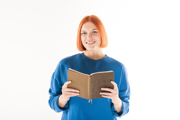 A girl is reading a book on a white background.