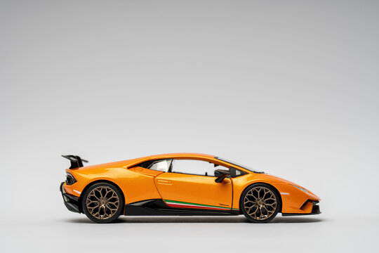 Budapest, Hungary - 2022 November 10 - Orange Lamborghini huracan toy on a white background. Selective focus