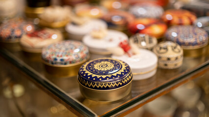 Metal gift boxes decorated with colorful turkish motifs, jewelry box, box with ottoman figures embroidered, blurred background, image with space for text