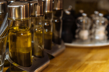 bottles of olive oil on the table in the Italian restaurant 