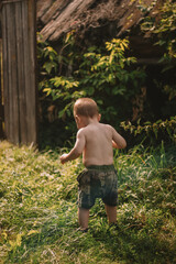 little child playing in the  garden