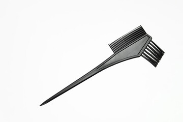 Professional hairdresser's accessories. Hair coloring brush on white background. Hair extensions, materials and cosmetics, hair care, wig. Hairstyle, haircut in salon.