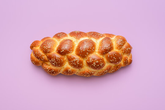 Challah bread above view, isolated on a purple background