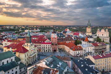 Beautiful panoramic skyline cityscape of Lublin, Lesser Poland. Aerial view of Królewska street and the old town landmarks at sunset: Cracow Gate (Brama Krakowska), Town hall (Ratusz), Cathedral - obrazy, fototapety, plakaty