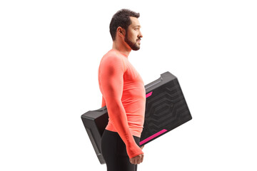 Man in sportswear holding a step aerobic platform