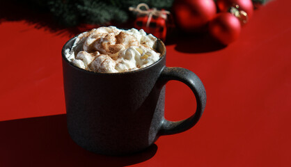 red Christmas background with hot chocolate and xmas decorations