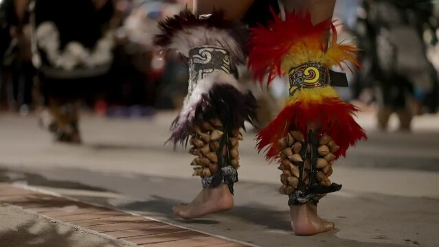 People dance the traditional Mexican Aztec dance at night 