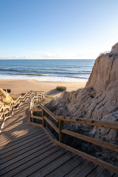 One of the most beautiful beaches in Spain, called (Cuesta Maneli, Huelva) in Spain.  Surrounded by dunes, vegetation and cliffs.  A gorgeous beach.