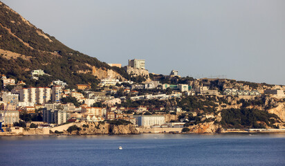 City Buildings, Port and Mountain by the Sea. Sunny Sky. Gibraltar, United Kingdom.