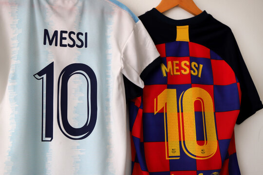  Argentina football shirt by Lionel Messi. Messi's Barcelona shirt. Number 10. light blue and white. AFA logo. Argentine Football Association. Adidas. Shield. Soccer player.