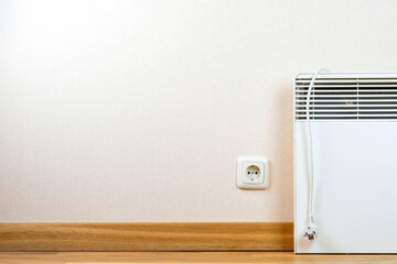 Electrical heater is switched off due to the energy crisis in world, sanctions and expensive and high energy prices. Concept of saving energy, electricity and power frugality.