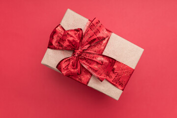 Doble red ribbon on a christmas present with red background