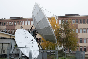 Television station or studio with large satellite dishes
