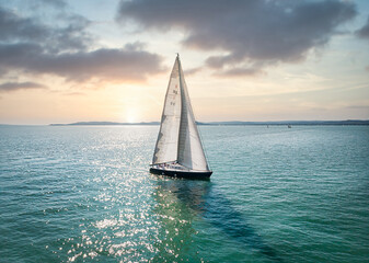 Sunset Sailing on calm lake