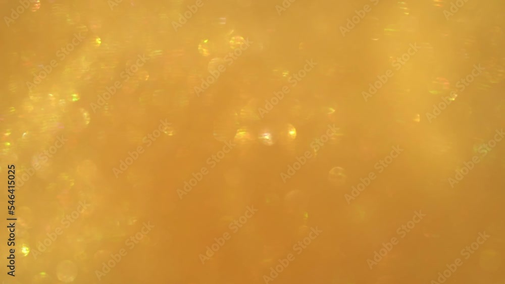 Canvas Prints a movement of gold dust particles bokeh. shimmering little cool bokeh on a golden background. chaoti