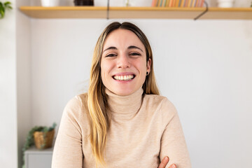 POV video call screen of smiling young adult woman looking at camera on virtual meeting