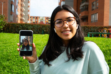 woman taking a selfie photo with phone smiling