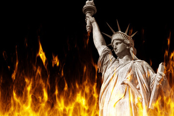 Statue of Liberty on fire. Monument is symbol of USA. Statue of Liberty from New York. Political crisis in USA concept. Flame under Statue of Liberty. Burning memorial with woman. 3d rendering. © Grispb